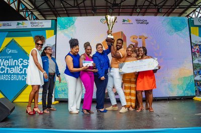 Representatives from Fraser Fontaine & Kong celebrate after being announced winners of the Jamaica Moves Corporate Wellness Challenge 8x8 Edition Awards Brunch held at Serengeti at Hope Zoo in Kings